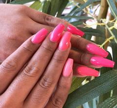 Fingers with pink nail salon nails