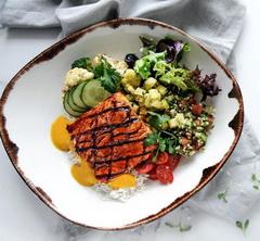 Plate of grilled salmon and vegetables