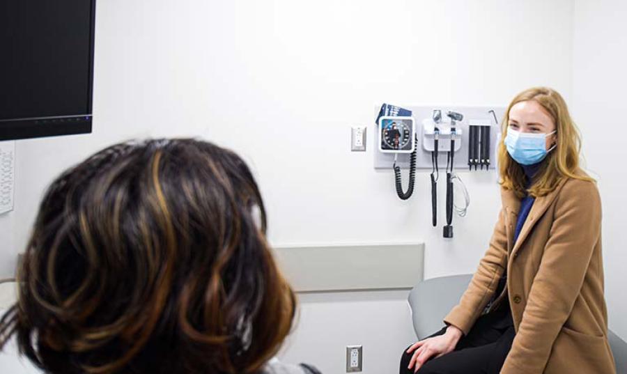 A patient sits in a doctor's office