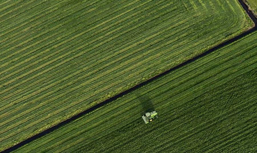 A tractor drives through a field
