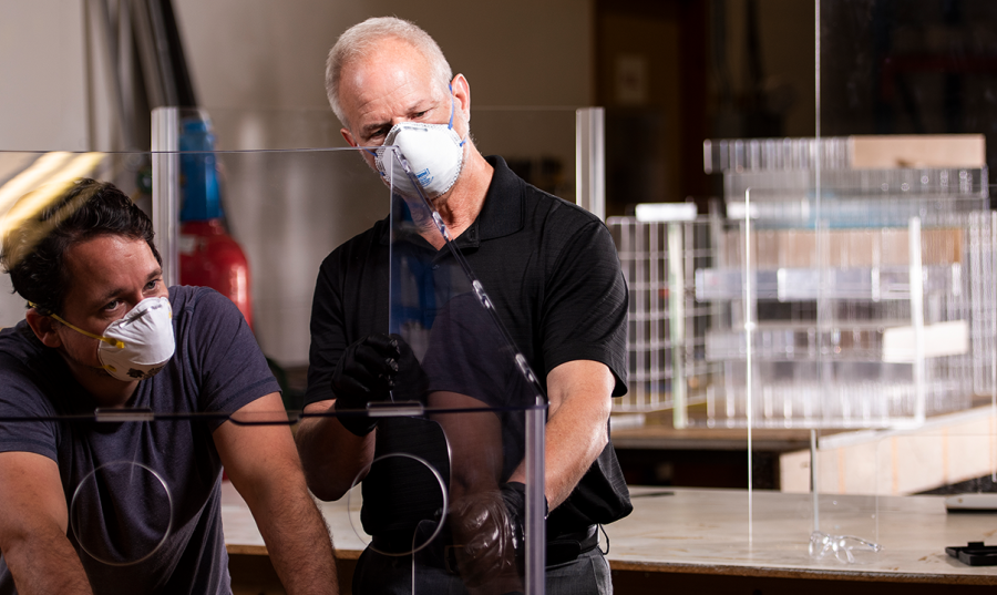 two people in a lab testing something