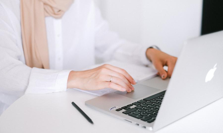 Person typing on a laptop